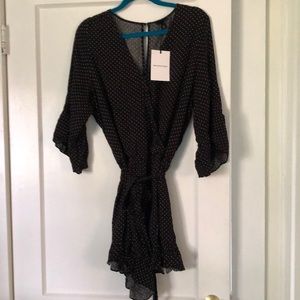 Women’s XL black and white dot jumpsuit.